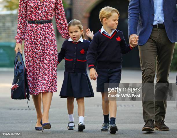 Princess Charlotte, waves as she arrives for her first day at school, with her brother Prince George and her parents the Duke and Duchess of...