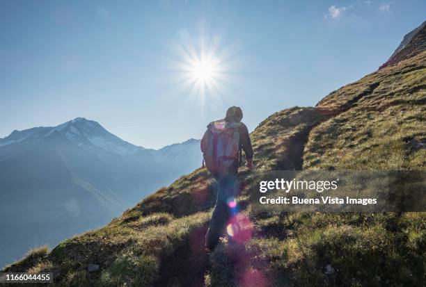 senior climber on a mountain ridge - mountain peak climb stock pictures, royalty-free photos & images