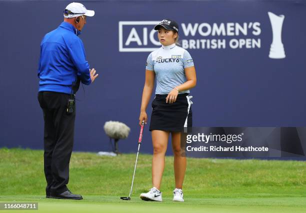 Jeongeun Lee6 of Korea Republic is spoke to by a referee on the 12th green during Day Four of the AIG Women's British Open at Woburn Golf Club on...