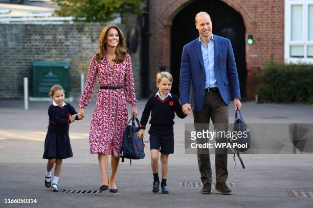 Princess Charlotte arrives for her first day of school, with her brother Prince George and her parents the Duke and Duchess of Cambridge, at Thomas's...