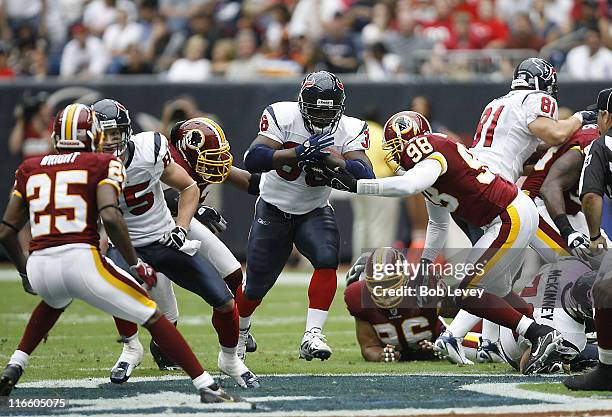 Houston Texans running back Ron Dayne runs through a gaping hole in the Washington Redskins defense at Reliant Stadium, Houston, Texas, September 24,...