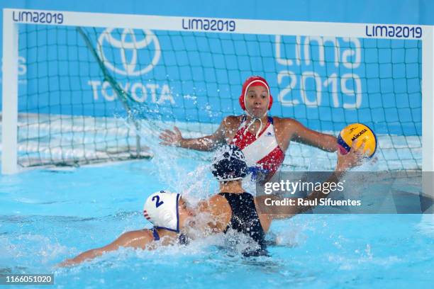 Kiley Neushul of United States scores during Women's Waterpolo Preliminary Group A match between United States and Puerto Rico at Aquatic Center of...