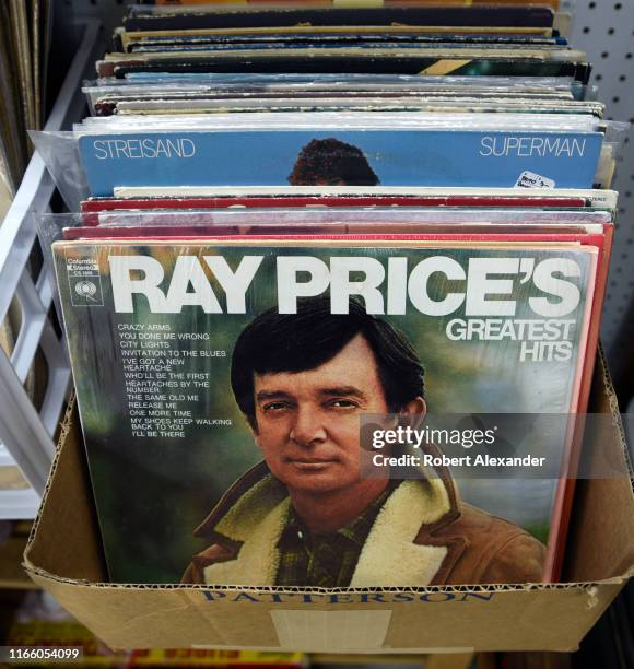 Cardboard box in an antiques and collectibles shop in Newport, Oregon, holds a selection of used record albums for sale, included 'Ray Price's...