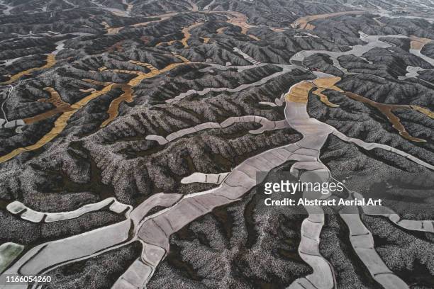 Majestic field patterns in the mountains seen from above, Aragon, Spain