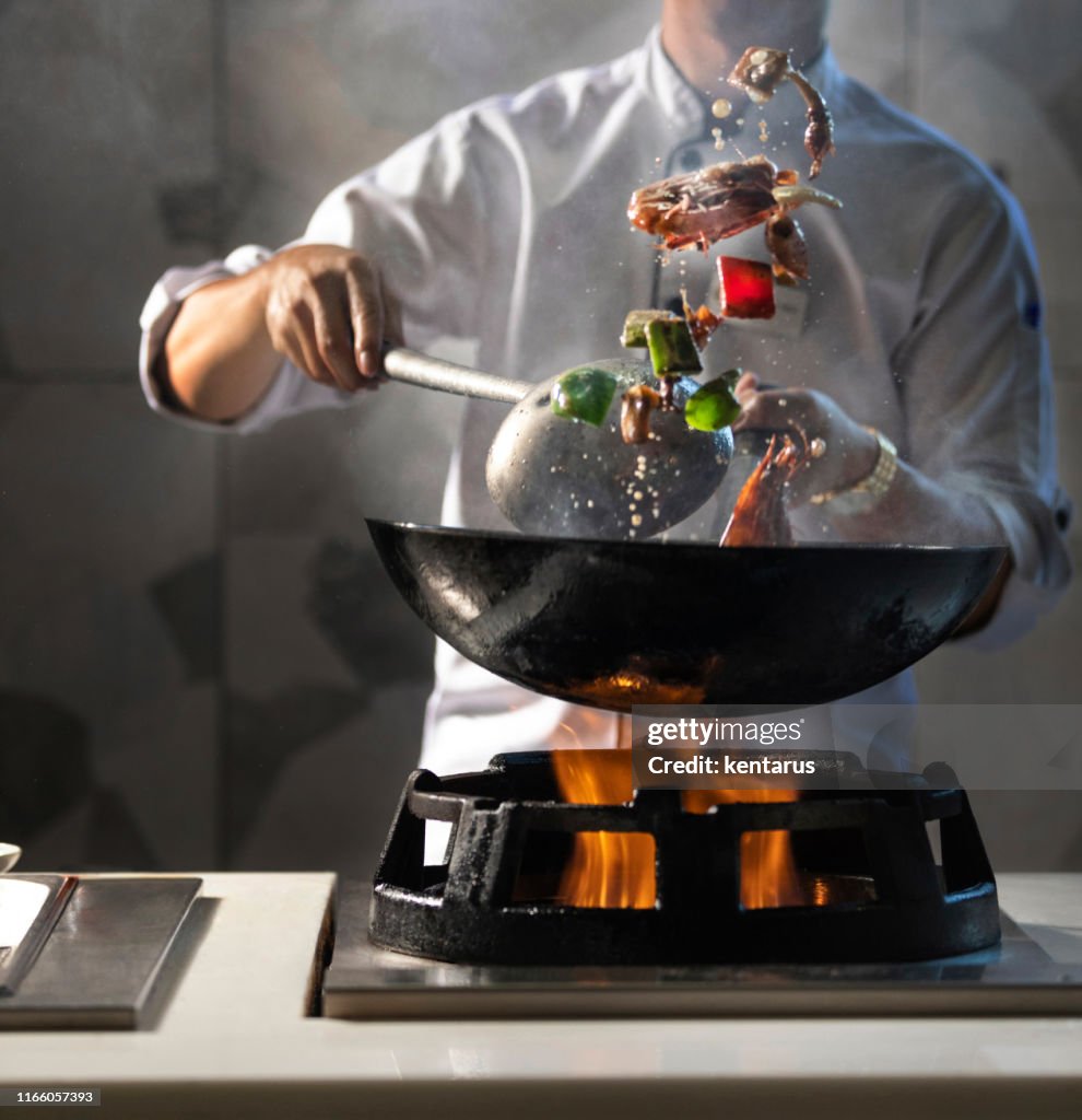 Pot with fire, chief cooking.
