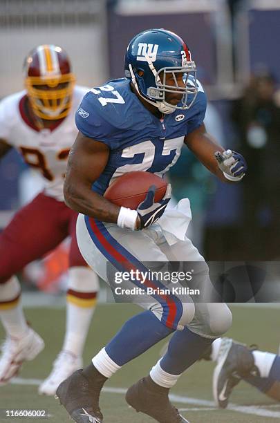 New York Giants running back Brandon Jacobs looks for a hole to run through against the Washington Redskins at Giants Stadium in East Rutherford, NJ...