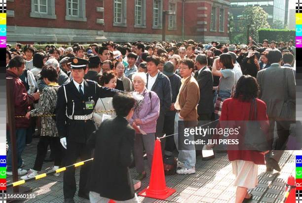 Throng line the sidewalk outside Tokyo District Court 14 April hoping to gain admission to the sentencing of seriel child killer Tsutomu Miyazaki....