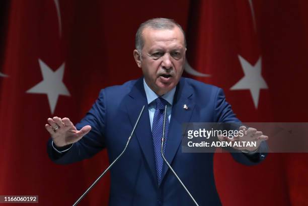 Turkish President and leader of Justice and Development Party Recep Tayyip Erdogan delivers a speech during AK Party's extended meeting of Provincial...
