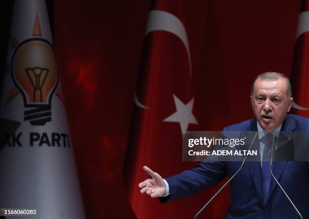 Turkish President and leader of Justice and Development Party Recep Tayyip Erdogan delivers a speech during AK Party's extended meeting of Provincial...