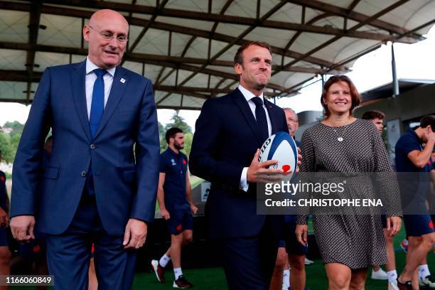 France's President Emmanuel Macron, French Rugby Federation President Bernard Laporte and French Sports Minister Roxana Maracineanu pose for a...