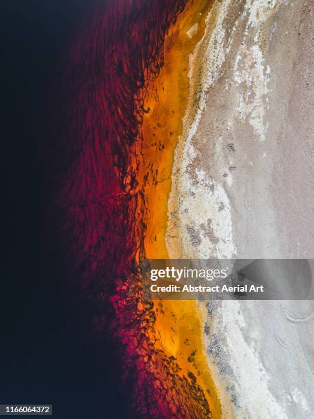 section of riverbank of the rio tinto river seen from above, spain - eisenerz stock-fotos und bilder