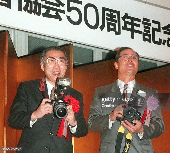 Japanese Prime Minister Keizo Obuchi prepares to take a picture of ...