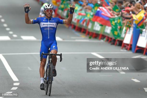 Team Deceuninck rider Belgium's Philippe Gilbert crosses the finish line of the twelfth stage of the 2019 La Vuelta cycling Tour of Spain, a 171,4 km...