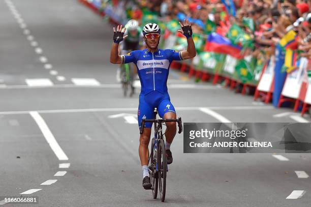 Team Deceuninck rider Belgium's Philippe Gilbert crosses the finish line of the twelfth stage of the 2019 La Vuelta cycling Tour of Spain, a 171,4 km...