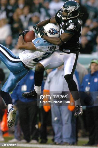 Tennessee Titans corner back Cortland Finnegan has the ball in his hands and Philadelphia Eagles wide receiver Donte Stallworth on his back during...