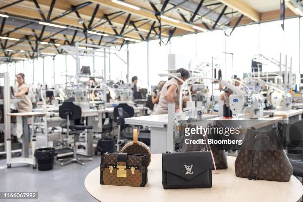 From left to right, luxury leather bags Pochette Trunk, Toile Monogram, Petite Boite Chapeau, MyLockMe BB, NeoNoe Rose Poudre, and NeoNoe Noir sit on...