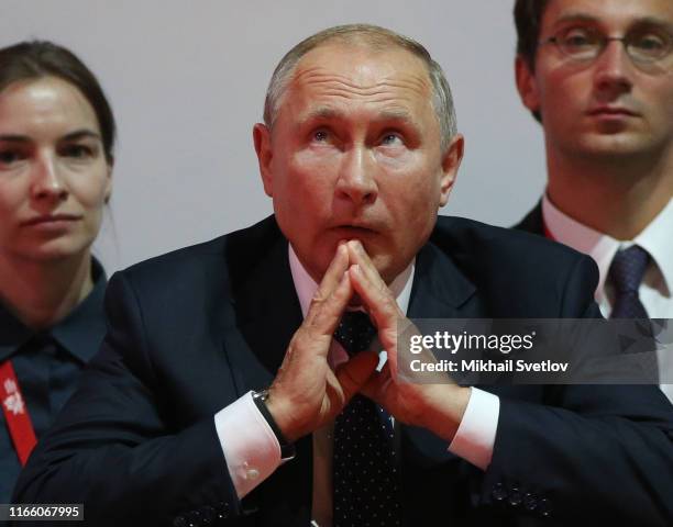 Russian President Vladimir Putin watches the fight while visiting the Annual International Vladivostok Jigoro Junior Judo Tournament after the...