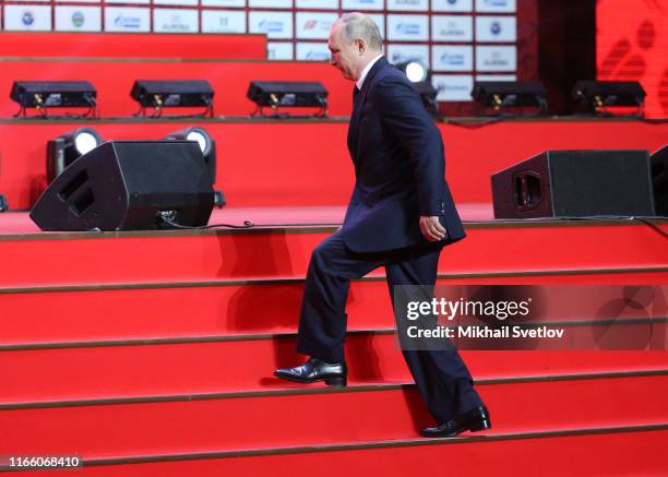 Russian President Vladimir Putin goes up the stairs while visiting the Annual International Vladivostok Jigoro Junior Judo Tournament after the...