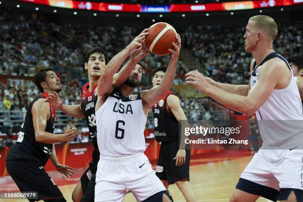 Joe Harris of USA in action against Avi Koki Schafer of Japan during the 1st round Group E match between USA and Japan of 2019 FIBA World Cup at the...