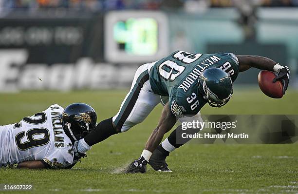 Eagles running back Brian Westbrook tries to get out of bounds while getting tackled by Jaguars corner back Brian Williams during the game between...