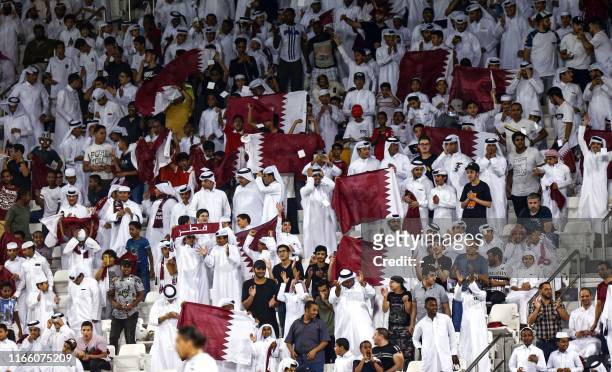 qatar-football-fans-cheer-for-their-team-during-the-second-round-group-e-qualification.jpg