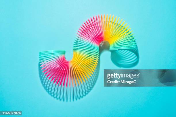 s shape stretched colorful coil spring - agility studio shot stock pictures, royalty-free photos & images