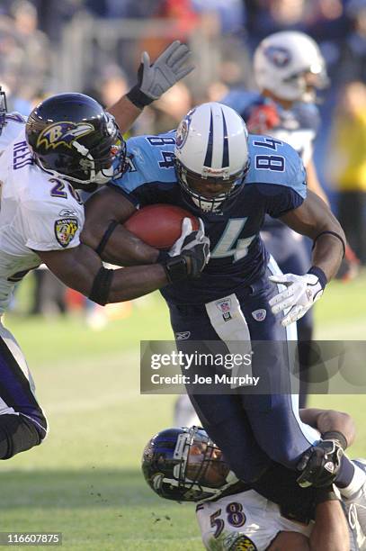 Ben Troupe of the Tennessee Titans against Ed Reed of the Baltimore Ravens against Ben Troupe of the Tennessee Titans during a game between the...