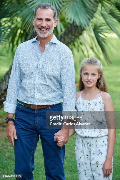 King Felipe VI of Spain and Princess Leonor of Spain pose for the photographers during the summer photocall at the Marivent Palace on August 04, 2019...
