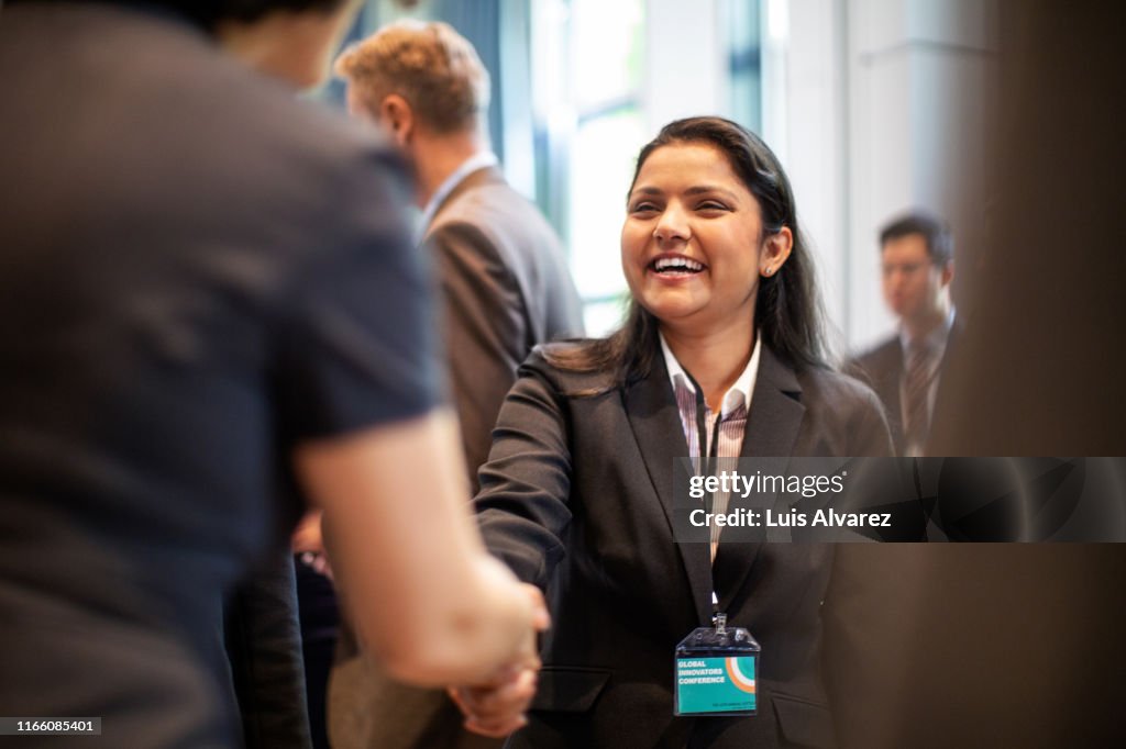Business women doing handshake in meeting