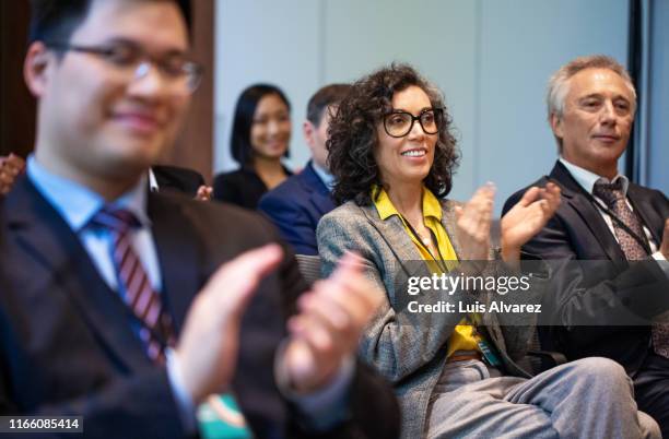 business professionals applauding during conference - clapping hands conference stock pictures, royalty-free photos & images