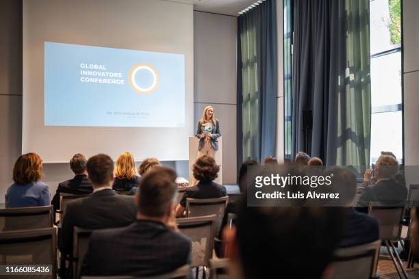 businesswoman explaining new ideas and strategy in seminar - launch event stock pictures, royalty-free photos & images