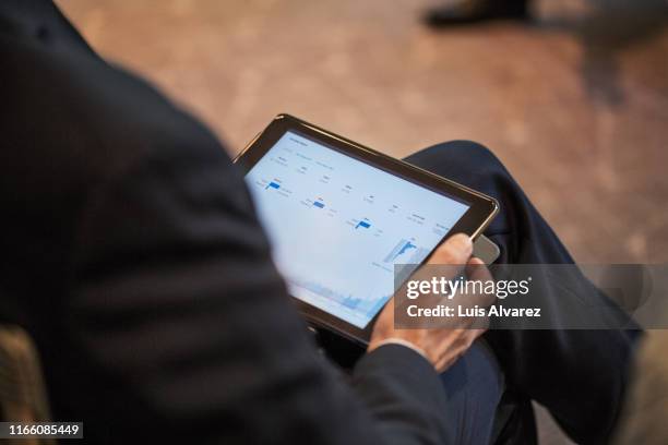 businessman using a digital tablet during seminar - tablet screen stockfoto's en -beelden
