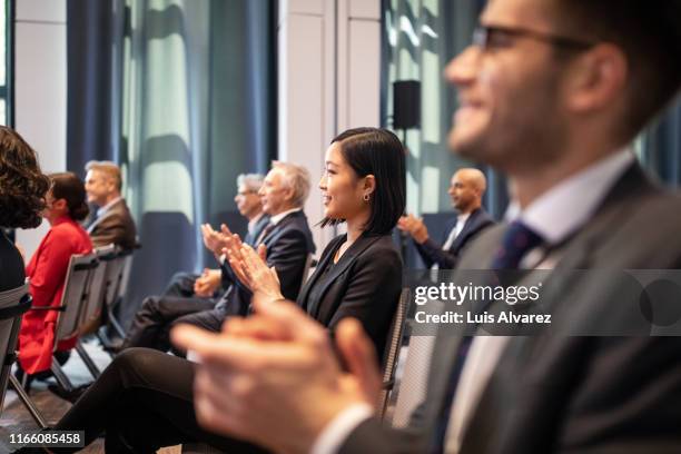 corporate professionals applauding during seminar - セミナー　日本人 ストックフォトと画像