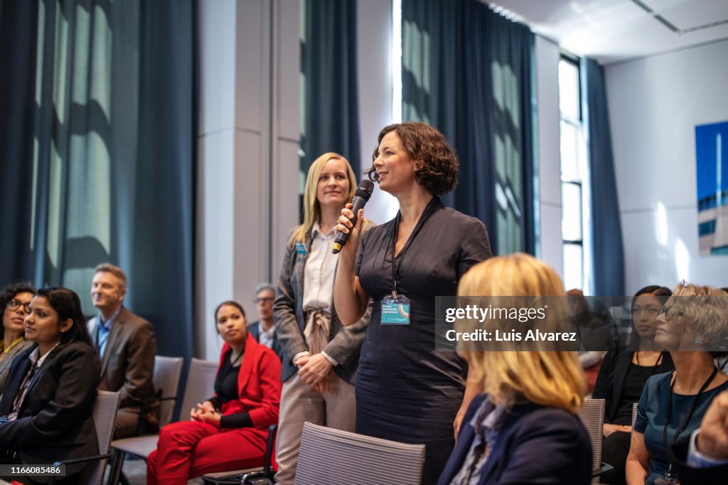 Woman asking questions during launch event