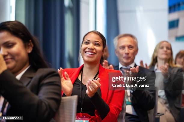 business people applauding during launch event - publikum stock-fotos und bilder