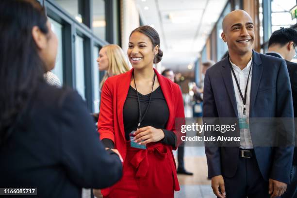 business people greeting each other in coffee break at seminar - attendance imagens e fotografias de stock