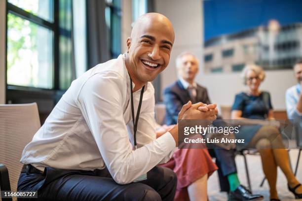 cheerful businessman at networking seminar - corporate portraits depth of field stock pictures, royalty-free photos & images