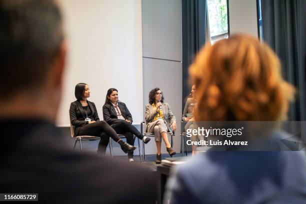 female expert panel discussing during conference - launch event stock-fotos und bilder