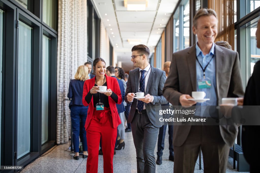 Business partners talking during coffee break