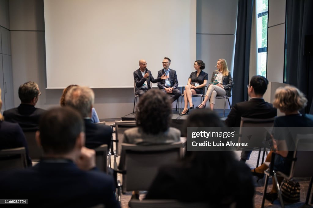 Professionals in convention center during seminar