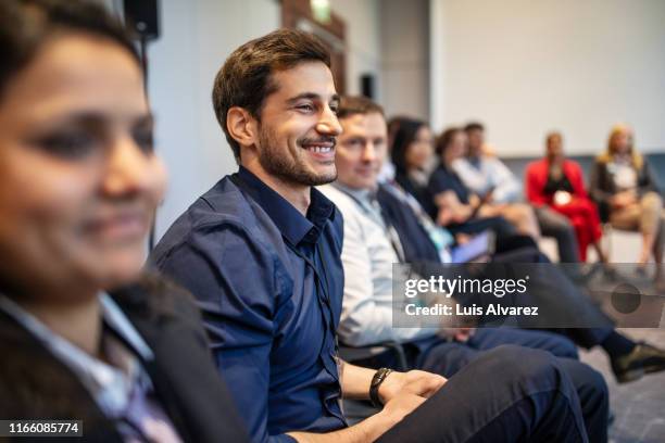 professionals attending a seminar in convention center - entertainment evenement stockfoto's en -beelden