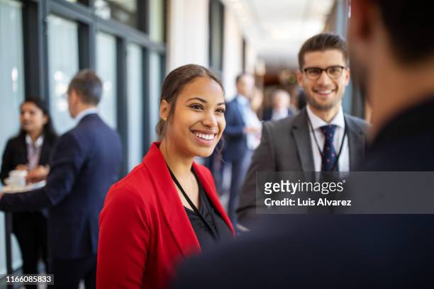 executives attending launch event at convention center - mixed race woman standing stock pictures, royalty-free photos & images