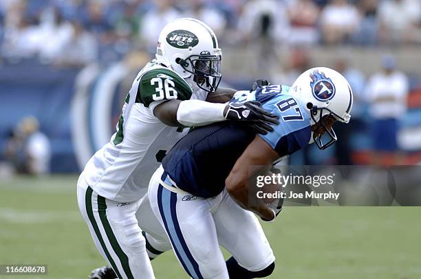 The Jets David Barrett tackles Titans wide receiver David Givens at The Coliseum, Nahsville, Tennessee, September 10, 2006.