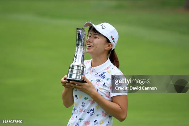 Hinako Shibuno of Japan kisses the trophy after her one shot victory in the final round of the AIG Women's British Open on the Marquess Course at...