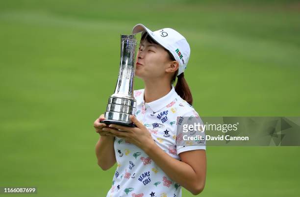 Hinako Shibuno of Japan kisses the trophy after her one shot victory in the final round of the AIG Women's British Open on the Marquess Course at...