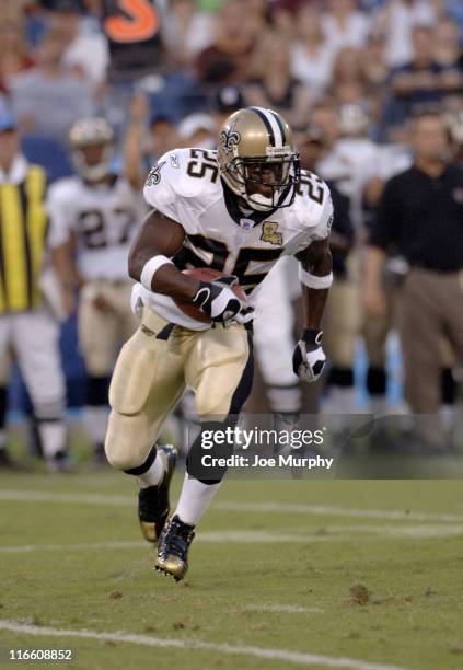 Saints Reggie Bush runs with the ball during first half action between The Tennessee Titans and the New Orleans Saints at The Coliseum in Nashville,...