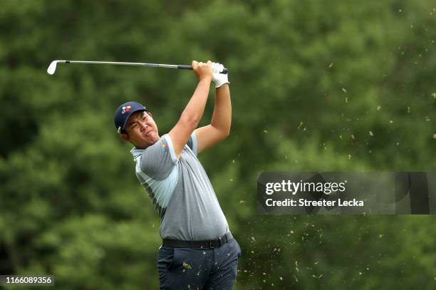 Byeong Hun An of South Korea hits a tee shot on the seventh hole during the final round of the Wyndham Championship at Sedgefield Country Club on...