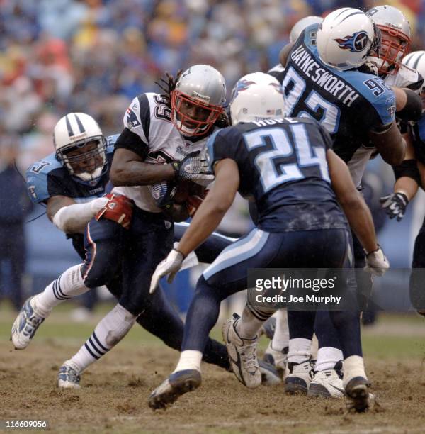 Patriots Laurence Maroney is tackled by Titans Keith Bulluck during 1st half action between the New England Patriots and the Tennessee Titans at LP...