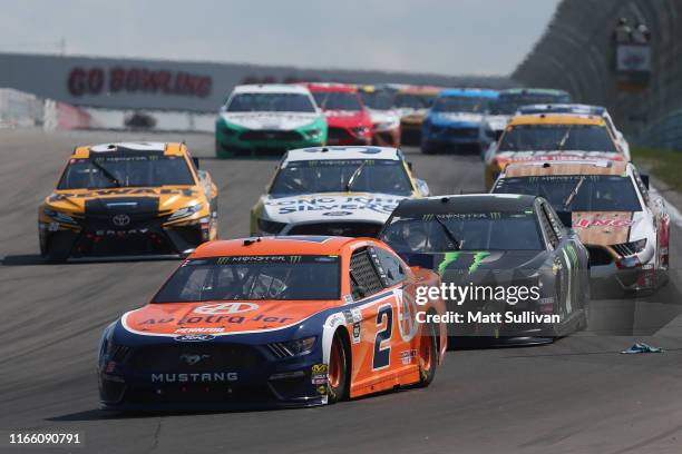 Brad Keselowski, driver of the Autotrader Ford, leads a pack of cars during the Monster Energy NASCAR Cup Series Go Bowling at The Glen at Watkins...