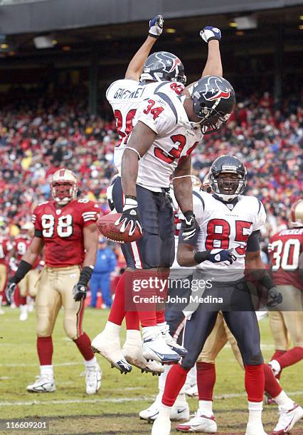 Houston running back Vernand Morency and receiver Jabar Gaffney celebrate a touchdown during the 49ers 20-17 overtime defeat of the Houston Texans...